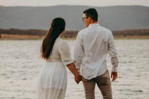 Couple having a peaceful morning walk together holding hands.