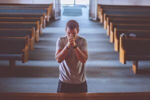 Morning Prayer For Widows: Widow praying at sunrise finding peace in God’s presence
