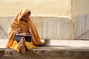 Morning Prayer For Widows: Elderly widow writing prayers in her journal.